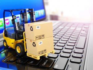 38652732 - concept of delivering, shipping or logistics. forklift on laptop keyboard. 3d